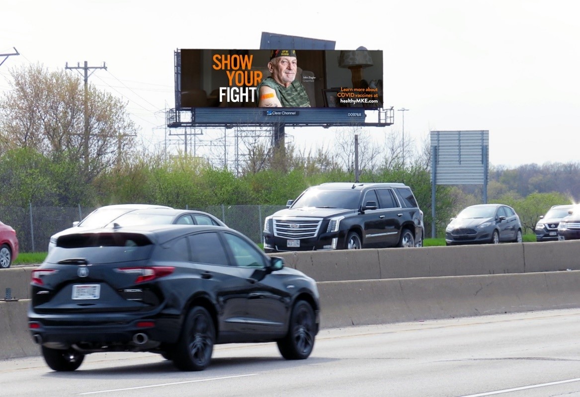 A picture containing text, road, sky, outdoor
Description automatically generated