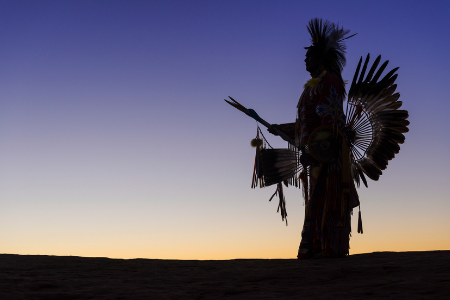 Native American in traditional headdress and clothing