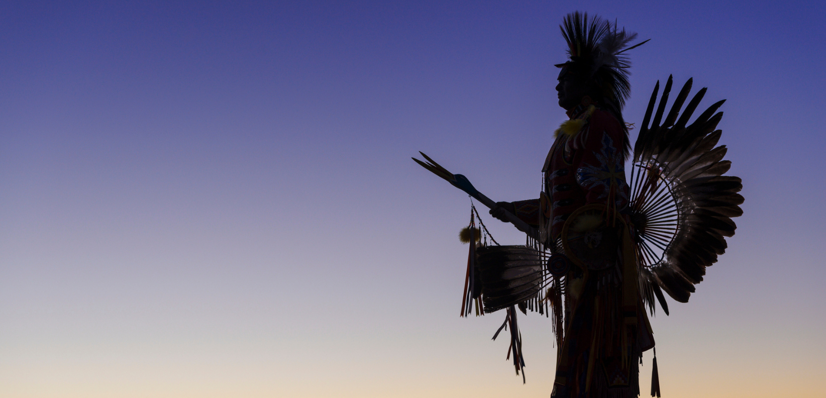 Native American in traditional headdress and clothing